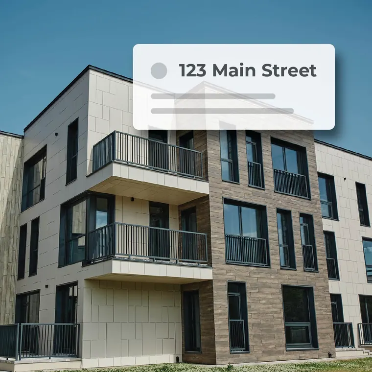 An apartment building with a property record card reading 123 Main Street