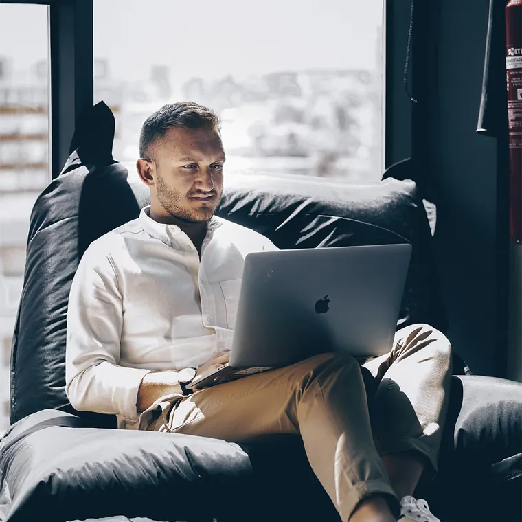 Someone reviewing commercial listings on a laptop